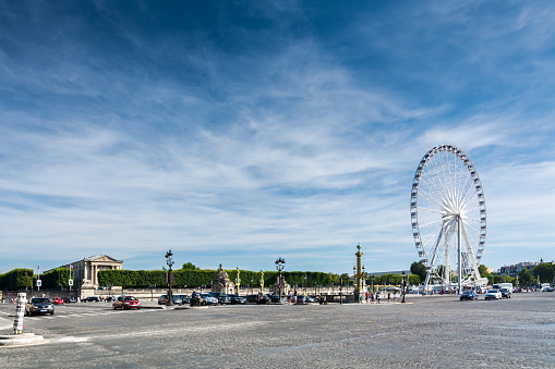 Paris, France - August 13, 2016: The ferris wheel on the Place de la Concorde is one of the major public squares in Paris, France. It is located in the city's eighth arrondissement, at the eastern end of the Champs-Elysees.