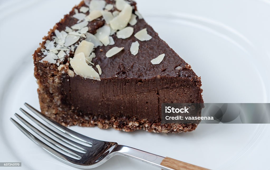 Chocolate raw vegan cake Chocolate raw vegan cake with nuts, figs and carob. Love for a healthy raw food concept.Chocolate raw vegan cake with nuts, figs and carob. Love for a healthy raw food concept. Almond Stock Photo