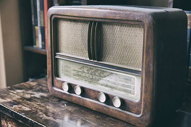 Wooden retro radio Obsolete radio in wooden case. Horizontal indoors shot radio retro revival old old fashioned stock pictures, royalty-free photos & images