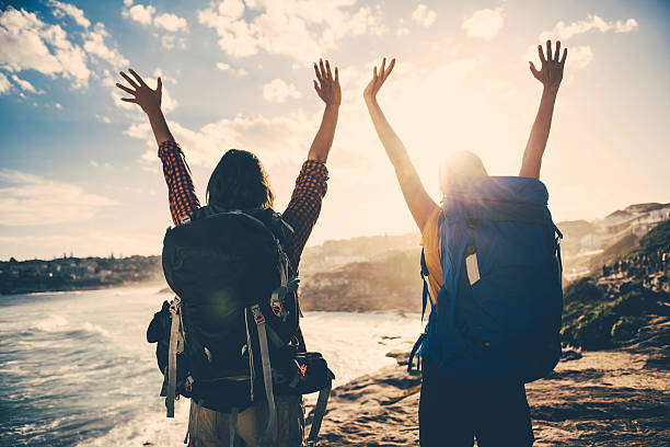 istock Two young women on vacation enjoying the sunset 637249030