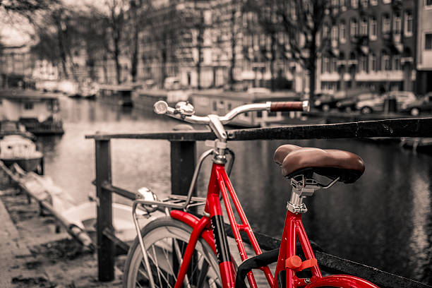 istock Beautiful sunset over Amsterdam, with bicycle selective colors 637254560
