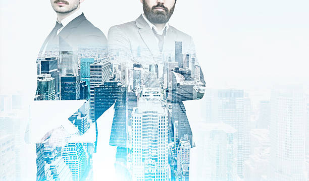 istock Two businessmen, cityscape, film effect 637254870