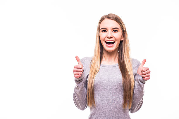 istock Young blonde girl with super gesture on white background 637256722