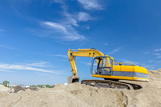 istock Excavator is preparing pile of sand for loading in truck. 637260760