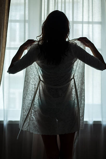 istock Lady standing near window. 637260916