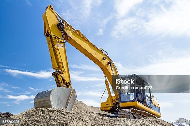 Excavator Is Preparing Pile Of Sand For Loading In Truck Stock Photo - Download Image Now