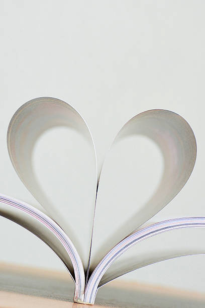 istock Heart shape of book page. 637265096