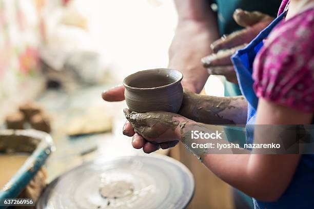 Girl Holding A Clay Bowl Made On Sculpting Wheel Stock Photo - Download Image Now - Child, Pottery, Ceramics