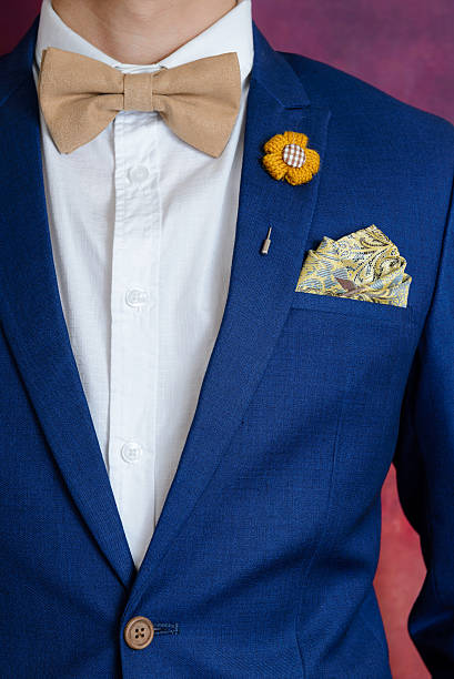 istock man in blue suit bowtie, pocket square 637267178