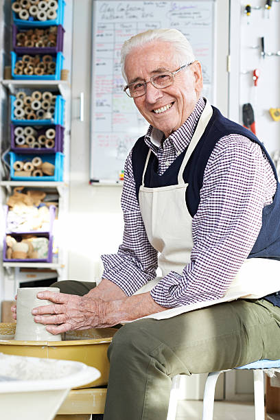 istock Senior Man Working At Pottery Wheel In Studio 637268500