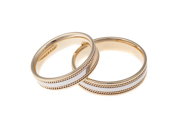 istock Golden wedding rings, isolated on white 637268898