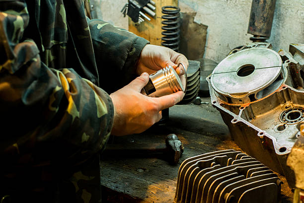 istock Repair of motorcycle engine in the garage 637269154
