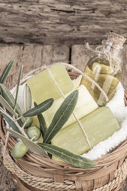 istock natural olive oil soap bars and olive oil on table 637270192