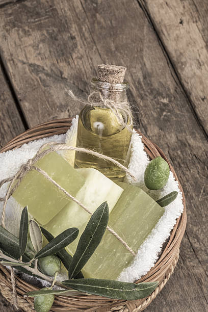 istock natural olive oil soap bars and olive oil on table 637271130