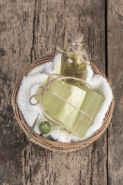 istock natural olive oil soap bars and olive oil on table 637271302