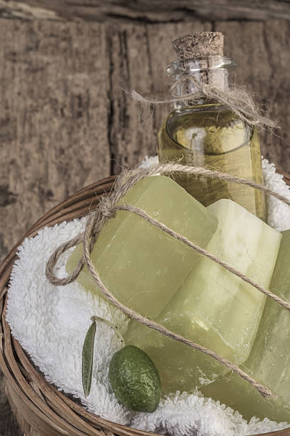 istock natural olive oil soap bars and olive oil on table 637271448