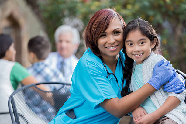 istock Caring nurse hugs young female Asian patient 637271468