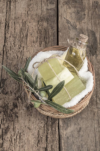 istock natural olive oil soap bars and olive oil on table 637271606