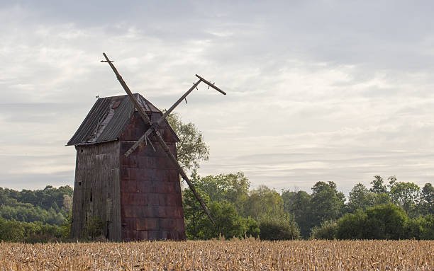 istock Kawnice, Poland. Old ruined windmill on the field. 637272220