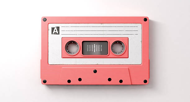 Pink Cassette Mix Tape A close up view of a pink vintage audio cassette tape with a white label that reads mix tape on an isolated white background audio cassette photos stock pictures, royalty-free photos & images