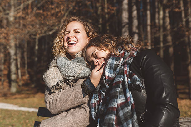 istock Cheerful couple sitting on a bench 637274824