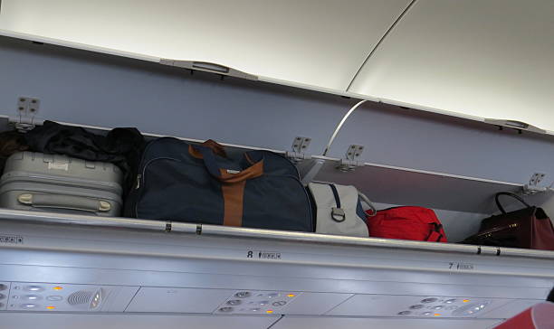 istock Hand-luggage compartment in an airplane 637275164
