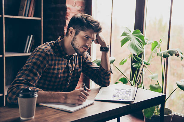 istock Young minded worker thinking of what he shoud do 637277376