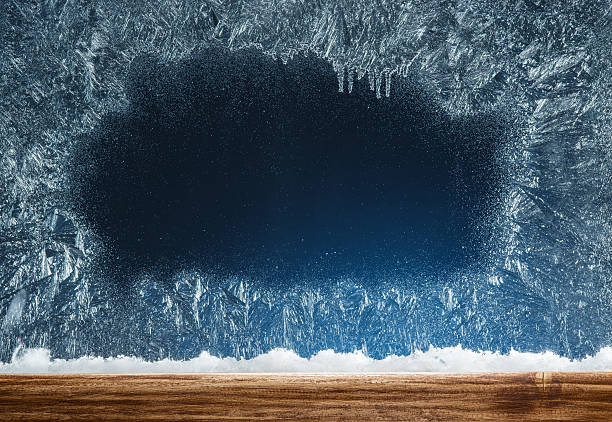 istock Wooden sill and frozen window. 637278904