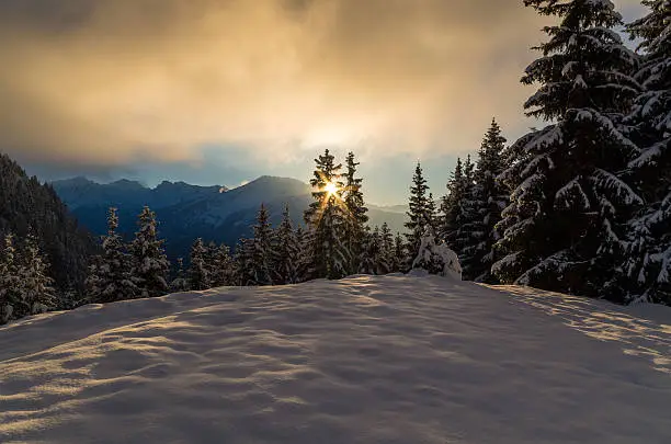 Winter scene with sunset in mountains near Oberstdorf, Germany