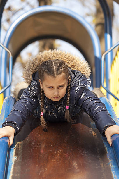 istock The girl playing on the playground 637282070
