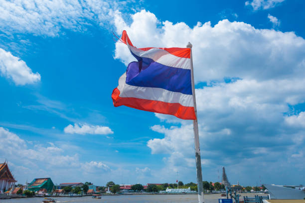 istock Thailand flag blowing in the wind above the river 637284858