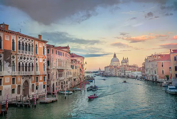 Evening view of the Grand Canal in Venice, Italy. Taken from Accademia Bridge with the  Basilica di Santa Maria della Salute in the distance.