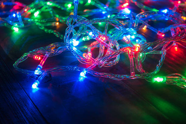istock Colorful flash lights on wooden background 637285462