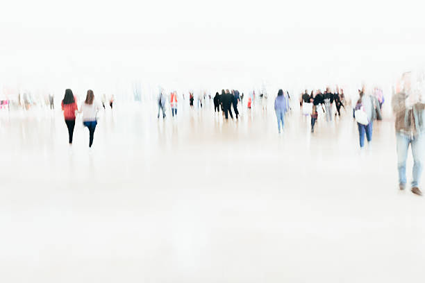 istock crowd of blur business people walking 637289712