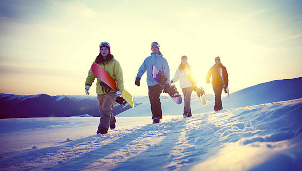 group of snowboarders on top of the mountain concept - heliskiing bildbanksfoton och bilder