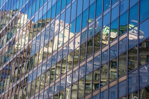 Reflection off windows on a building in Lower Manhattan. New York City, New York.