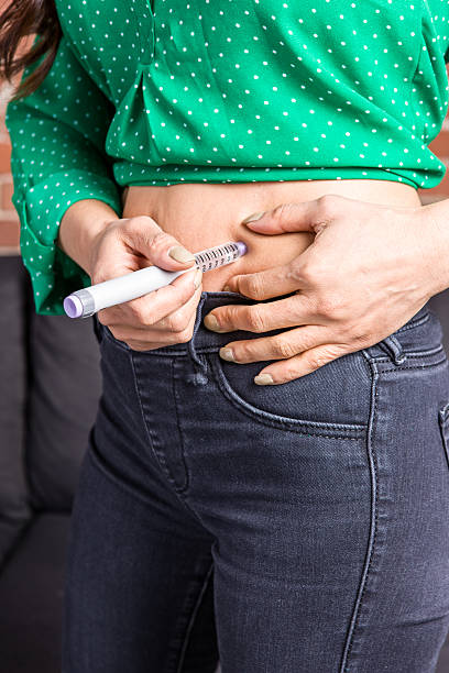 istock Asian Adult Using Insulin Pen 637290488