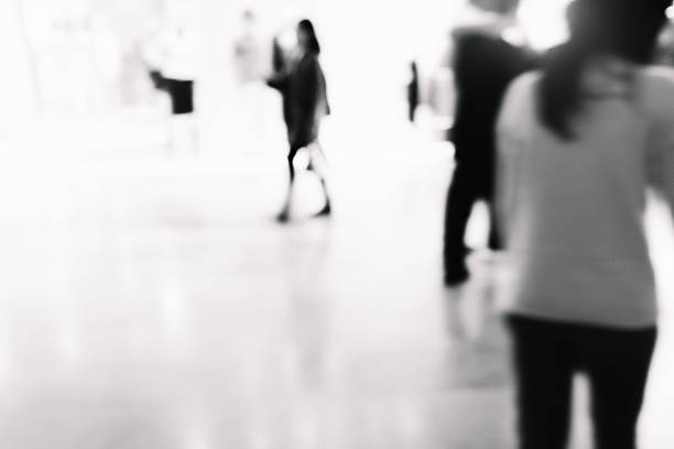 istock black and white blur business people walking 637290858