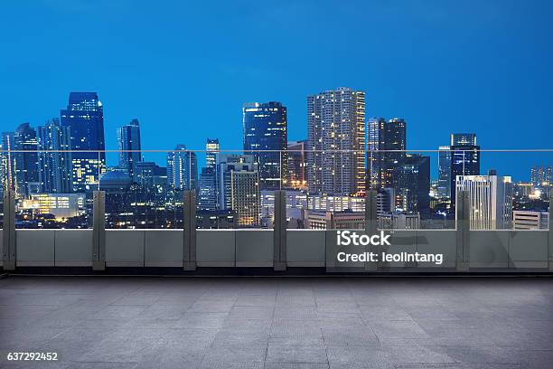 Empty Terrace With Cityscape And Skyscraper Stock Photo - Download Image Now - Balcony, Rooftop, Night