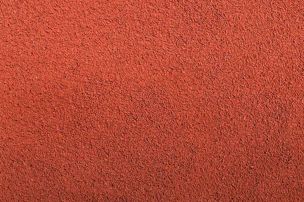 Photo of Running track rubber cover texture top view background.