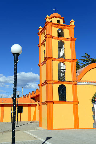 istock Colorful Orange Church with blue sky background, Mexico 637293874