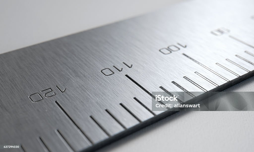 Steel Ruler Closeup A 3D render of a close up view of a section of a steel ruler with indented measurements on a white studio background Measuring Stock Photo