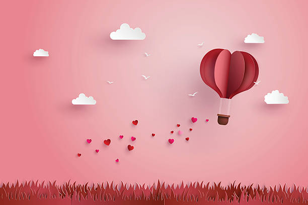 Origami made hot air balloon and cloud illustration of love and valentine day,Origami made hot air balloon fly over grass with heart float on the sky.paper art style. hearts playing card illustrations stock illustrations
