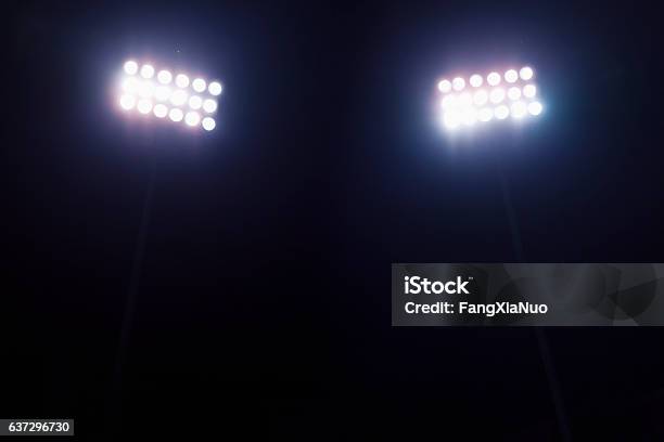 View Of Stadium Lights At Night Stock Photo - Download Image Now - Floodlight, Stadium, Lighting Equipment