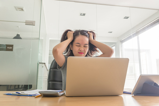 Asian businesswoman feel over stressed with her daily business