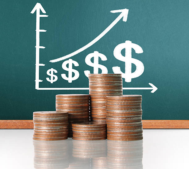 istock Coins graph stock market 637301210