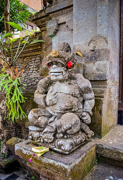 istock art ancient god statues with smile at Bali 637302074