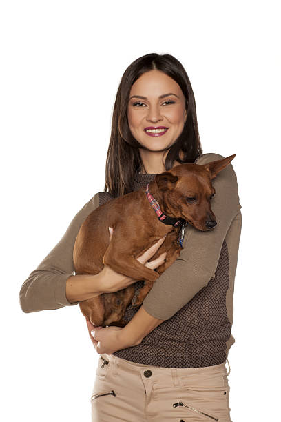 istock young happy woman posing her small dog 637302174