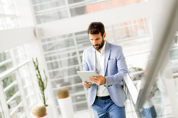 istock Young businessman with tablet 637304296