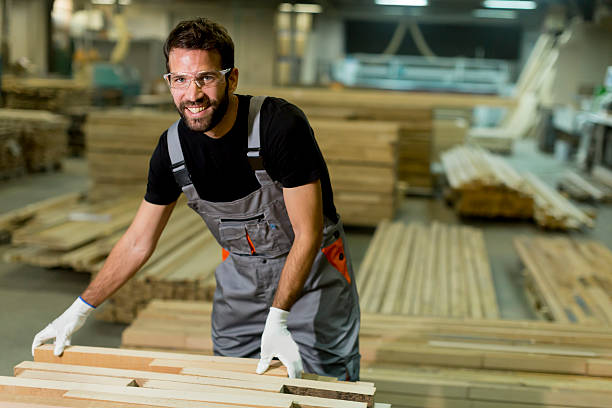 istock Handsome young man working in the lumber factory 637304456